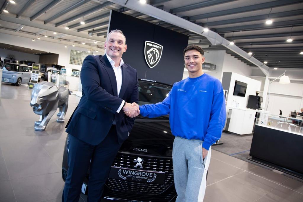 David Guy, group commercial director at Wingrove Motor Company, giving Cameron Vuong the keys to his new car