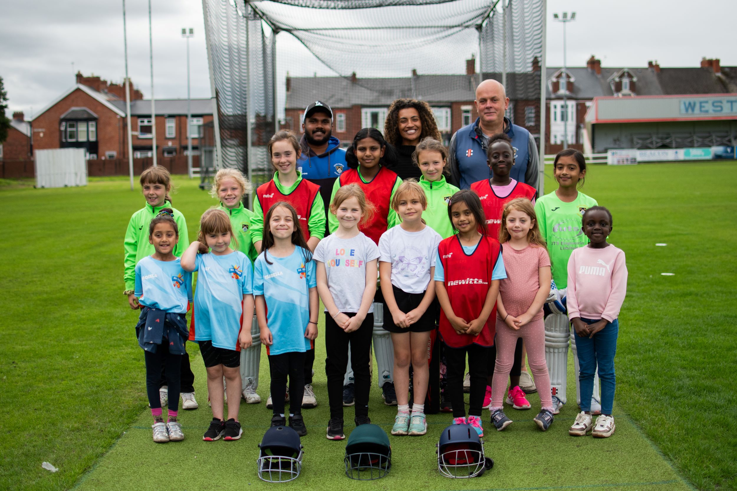Some of South Shields Cricket Club's young players, along with (back, centre) Jamilah Hassan of The Banks Group and (left) Tharusha Fernando and Patrick William-Powlett of South Shields Cricket Club