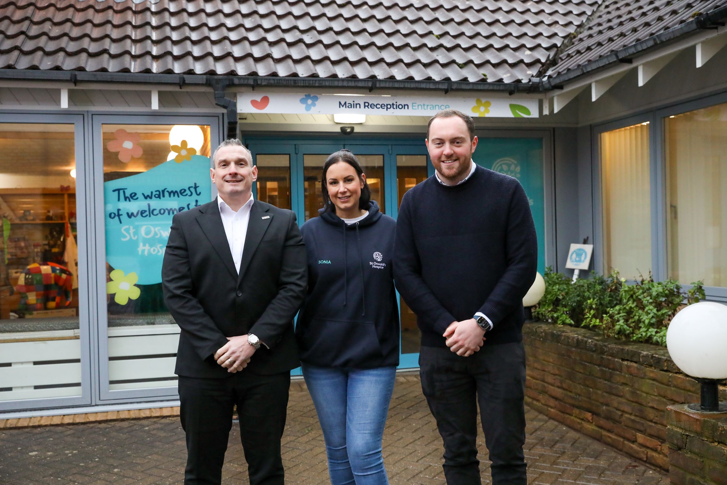 (centre) Sonia Graham, fundraising manager business partnerships at St Oswald's Hospice with (left) Wingrove Motor Company group commercial director David Guy and managing director Josh Parker
