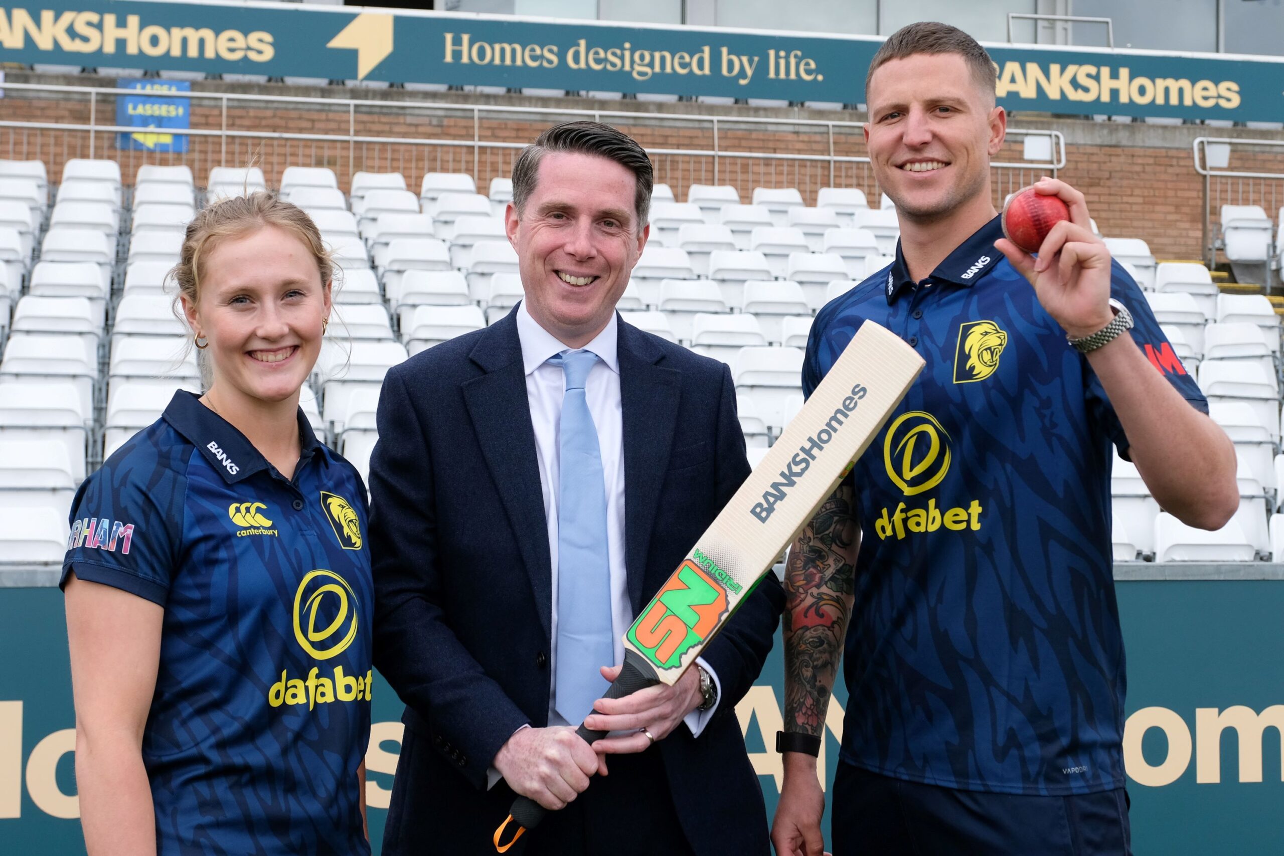 Durham Cricket players Lizzie Scott and Brydon Carse with Russ Hall, managing director of Banks Homes and Banks Property
