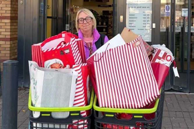 Pam Routledge, domestic worker at Ingleby Care Home, collecting gifts from the Stockton-on-Tees branch of Dunelm after generous donations from shoppers as part of the retailer’s Delivery Joy at Christmas campaign.