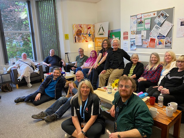 Starfish Services staff with attendees at one of its Place To Be sessions, along with (back right, seated) Kate Culverhouse of the Banks Group